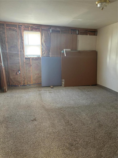 Unfurnished room with carpet floors