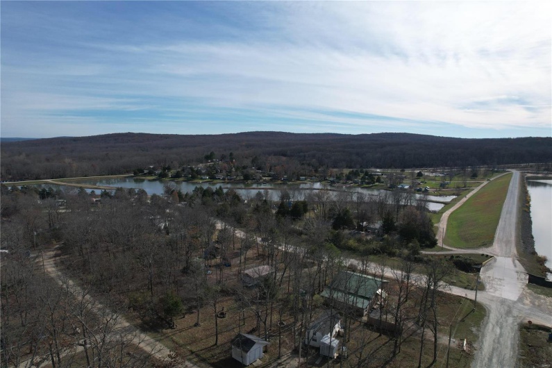 Property view of mountains with a water view