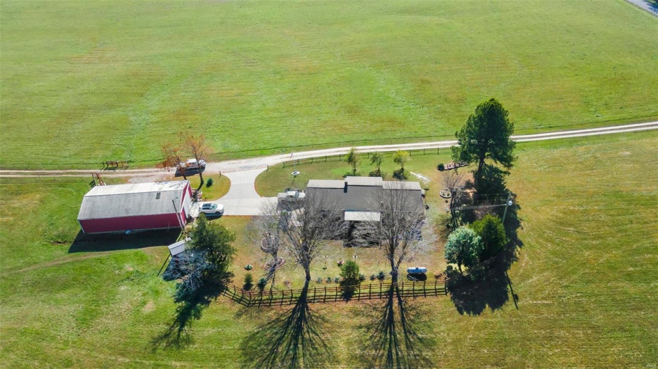 Birds eye view of property featuring a rural view