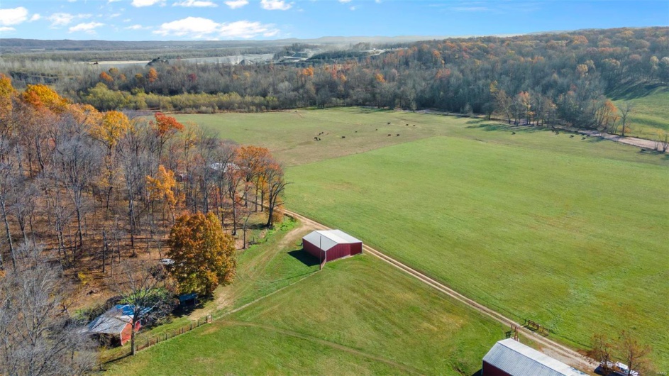 Birds eye view of property featuring a rural view
