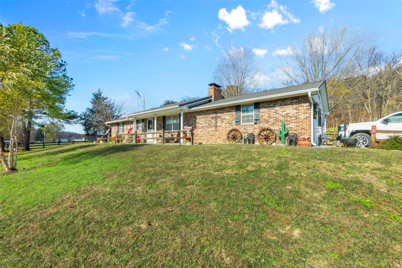 Rear view of property featuring a yard