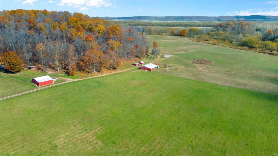 Birds eye view of property with a rural view