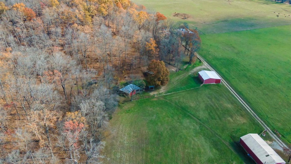 Birds eye view of property featuring a rural view