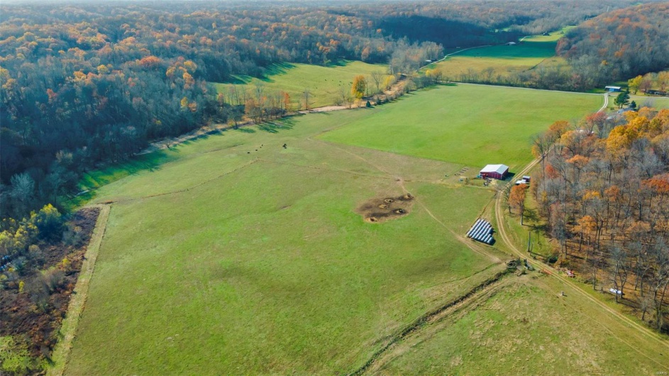 Birds eye view of property featuring a rural view