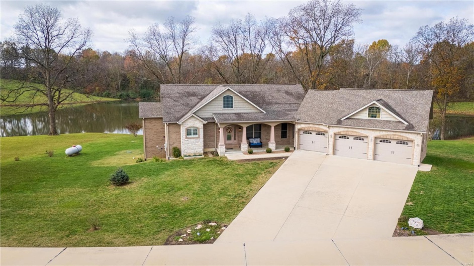 View of front of property with a water view.