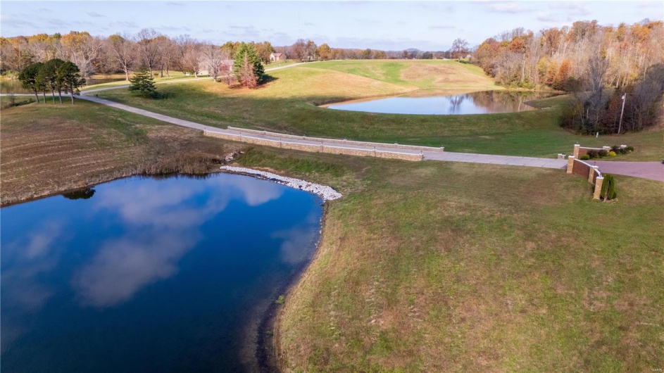 Aerial view of main access to subdivision with water views.