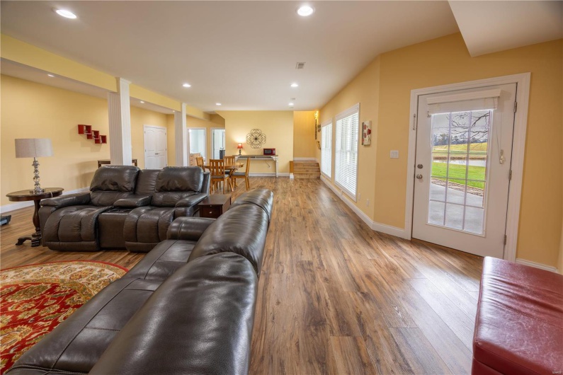 Family/rec room with LVP flooring and walk-out to backyard.