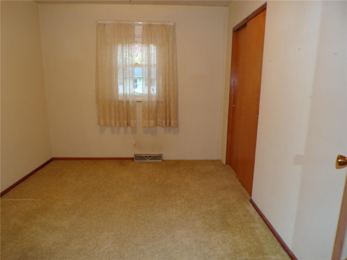3rd Bedroom featuring light colored carpet