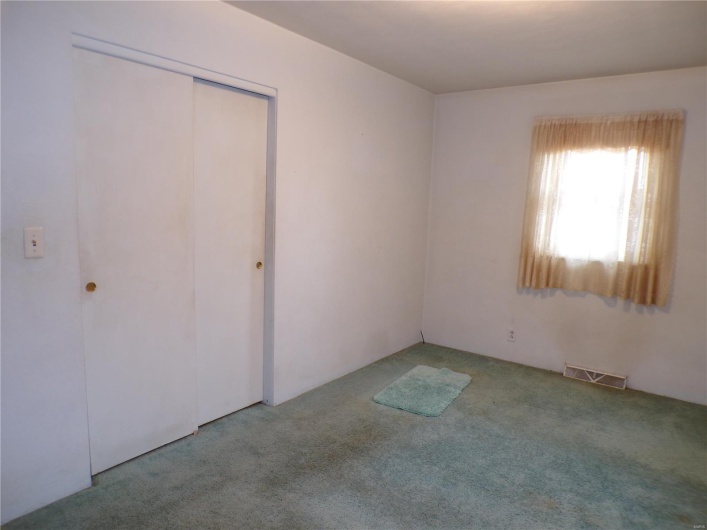Second bedroom featuring large closet