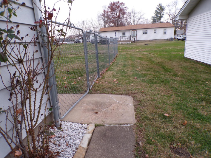 View of fenced back yard