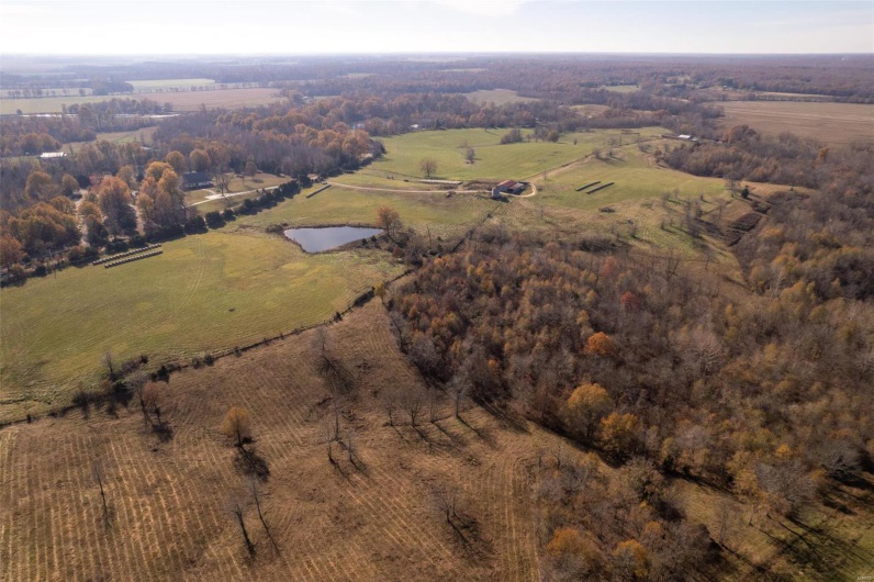 Birds eye view of property featuring a rural view