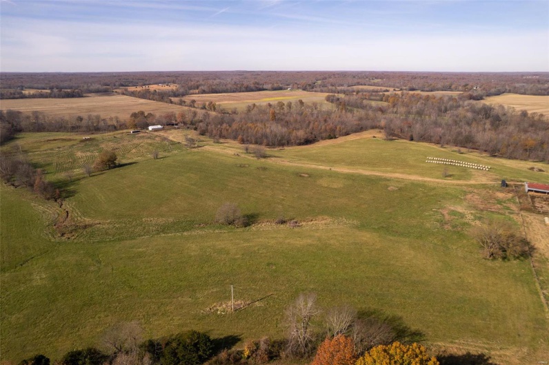 Birds eye view of property with a rural view
