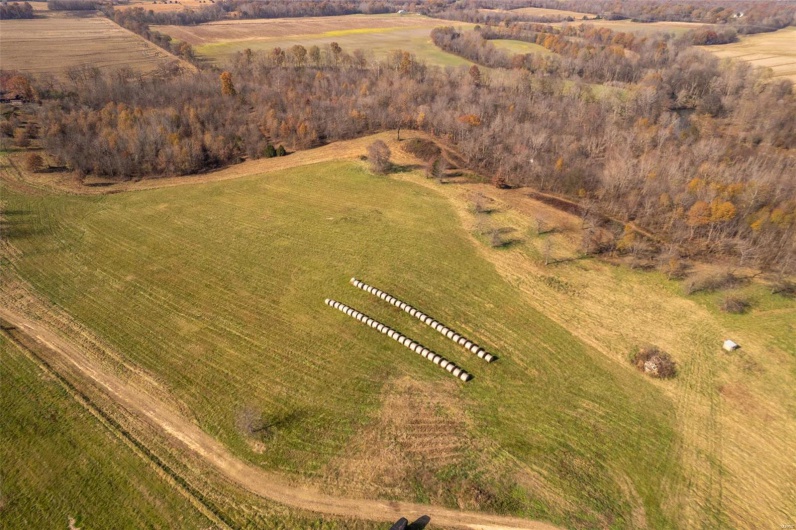 Birds eye view of property featuring a rural view