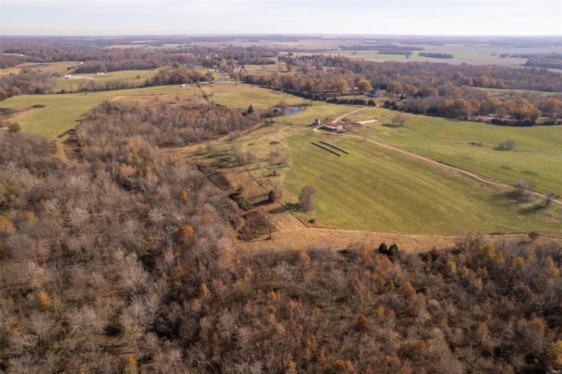 Birds eye view of property with a rural view