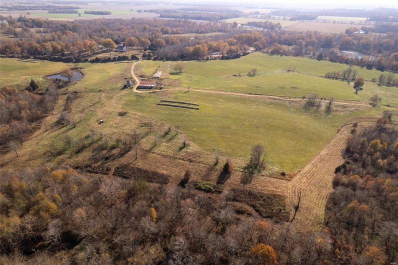 Birds eye view of property featuring a rural view