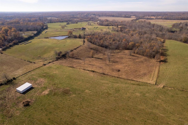 Aerial view with a water view and a rural view