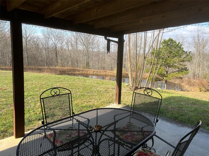 View of patio / terrace featuring a water view