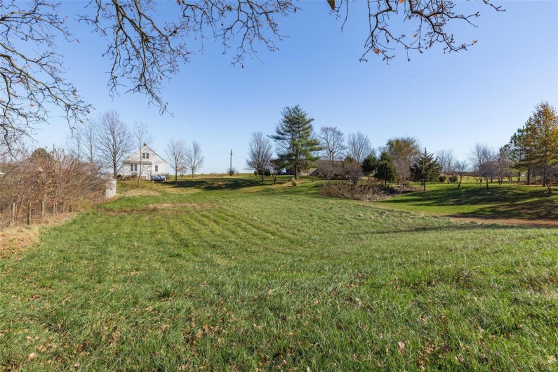 View of yard with a rural view