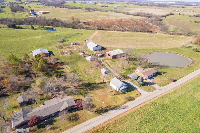 Birds eye view of property featuring a rural view and a water view