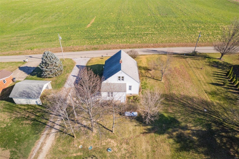 Birds eye view of property featuring a rural view