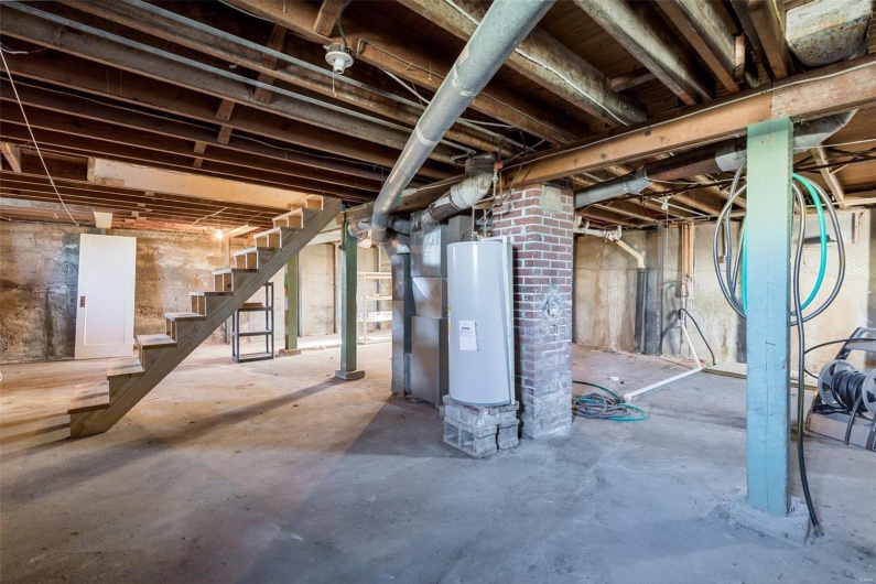 Basement featuring water heater