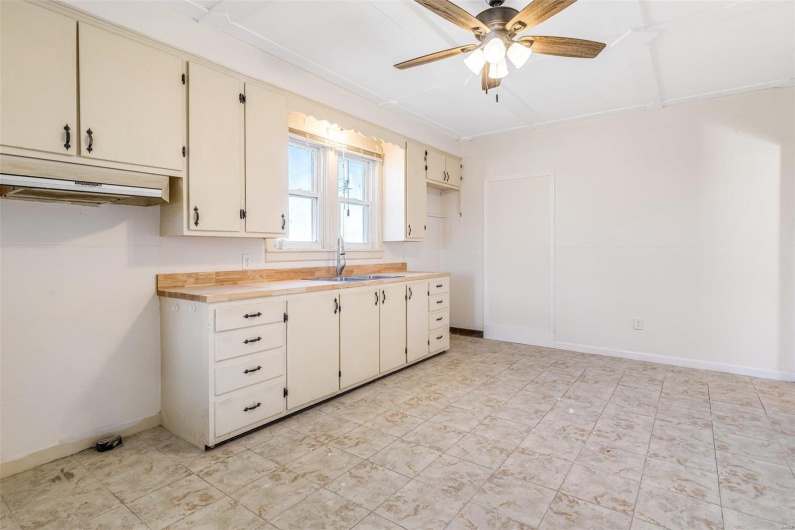Kitchen with ceiling fan and sink