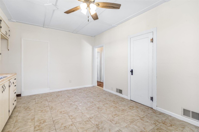Spare room with ceiling fan