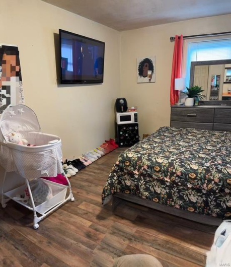 Bedroom featuring hardwood / wood-style flooring