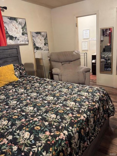 Bedroom featuring hardwood / wood-style flooring