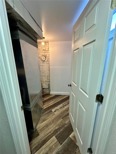 Hallway featuring dark hardwood / wood-style floors