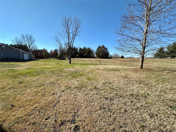View of yard with a rural view