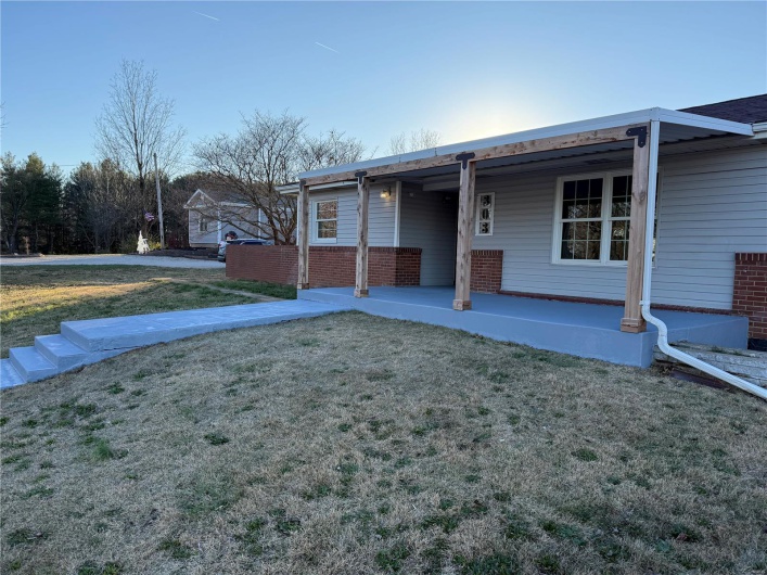 Ranch-style home featuring a front yard