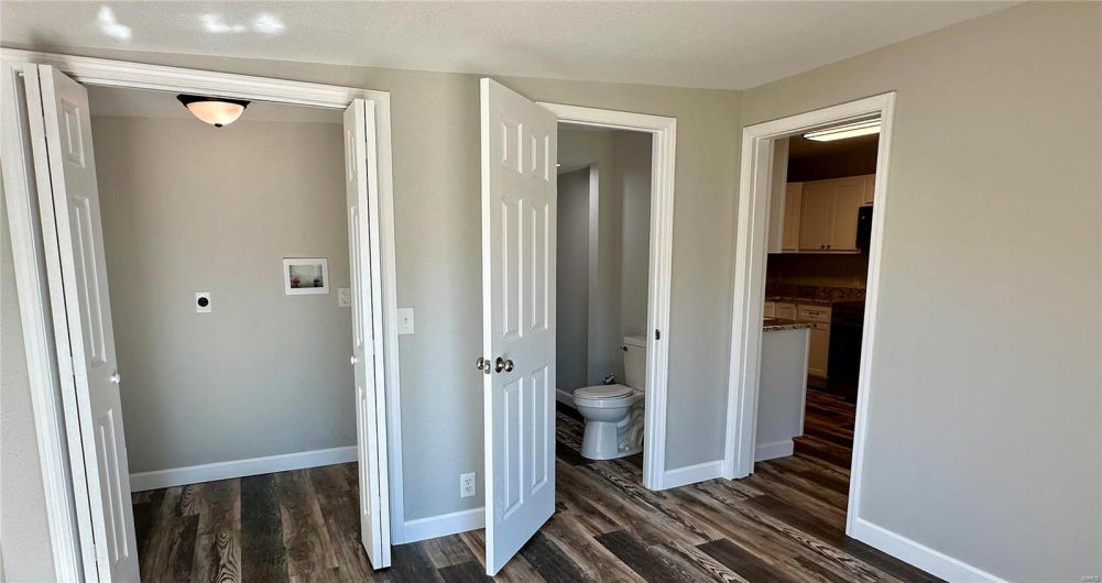 Corridor with dark wood-type flooring