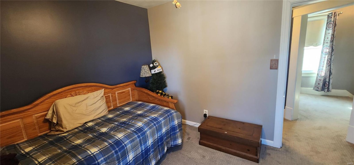 Bedroom featuring carpet