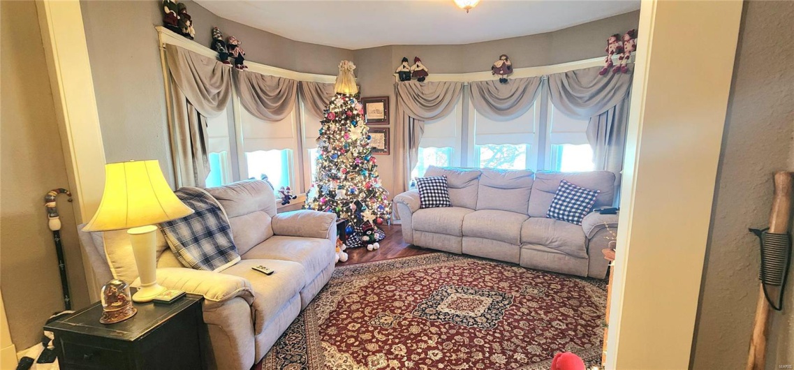 Living room with hardwood / wood-style flooring