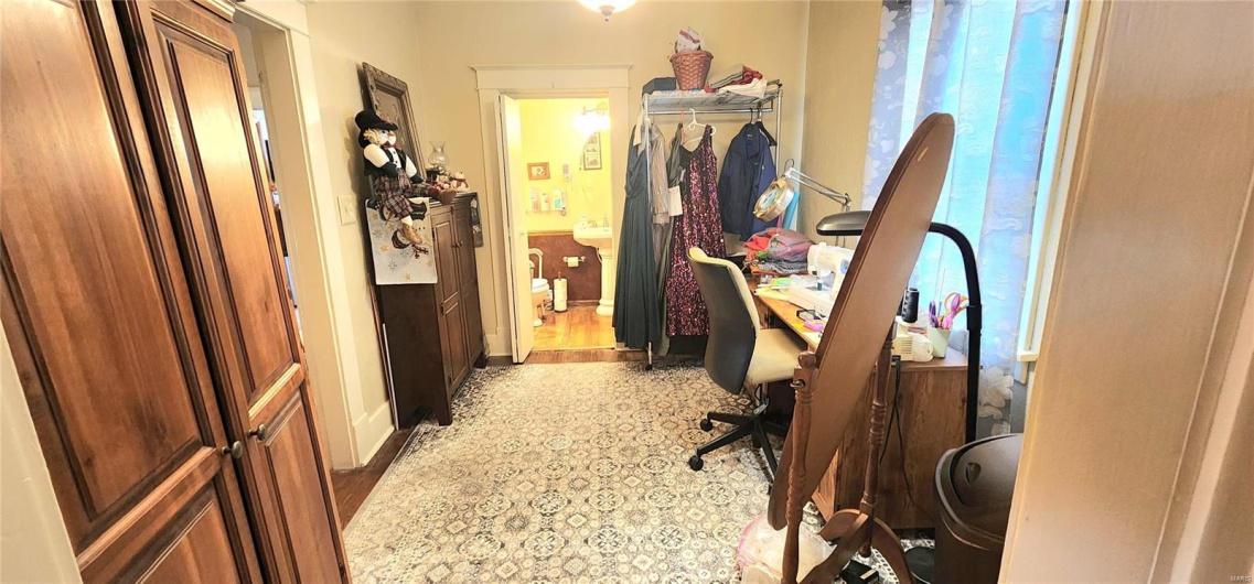 Office space with hardwood / wood-style floors and plenty of natural light