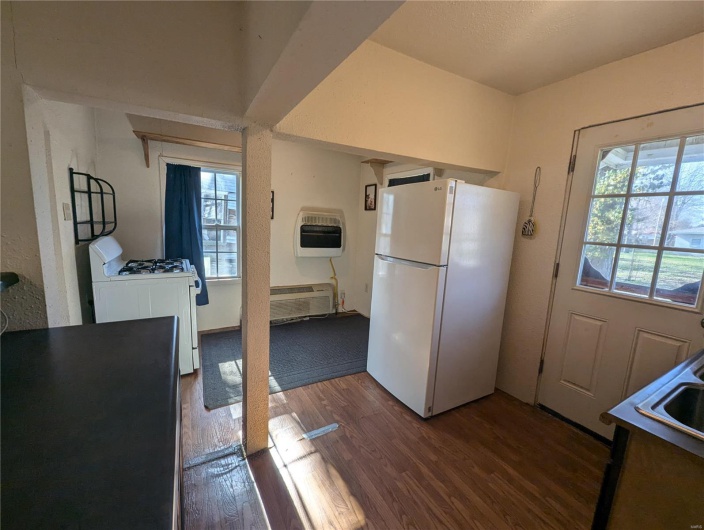 Kitchen with refrigerator and gas stove 
