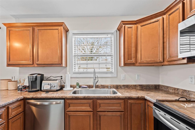 Kitchen with sink and stainless steel appliances