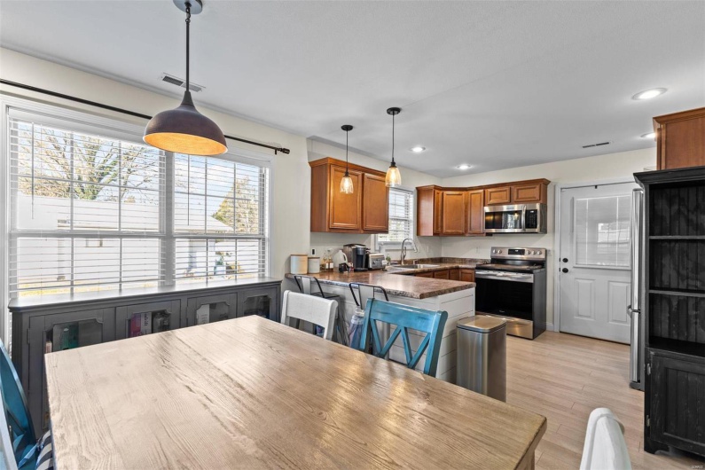 Dining room with sink and light hardwood / wood-style floors