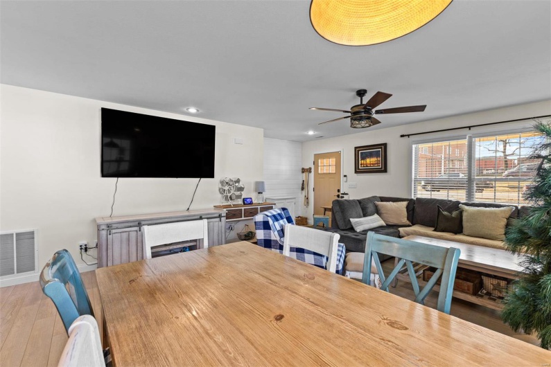 Dining room with hardwood / wood-style flooring and ceiling fan