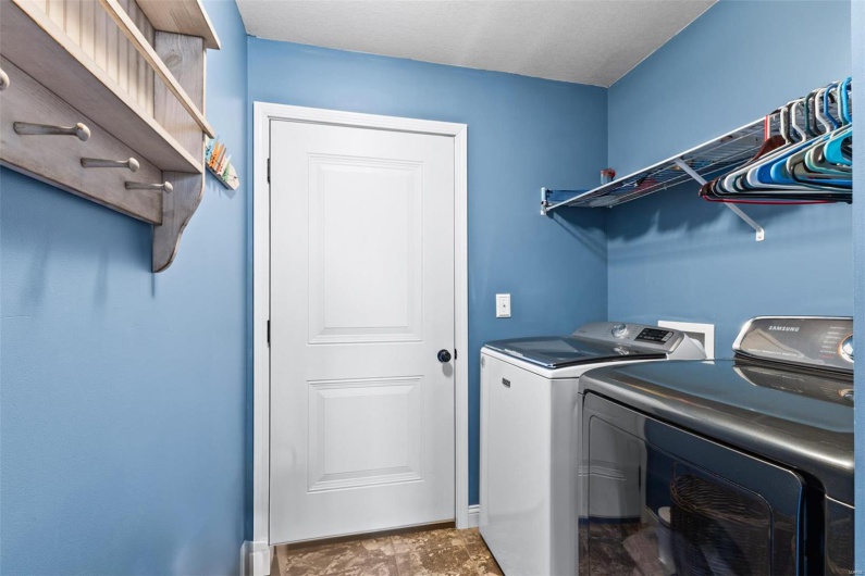 Laundry area with washing machine and clothes dryer