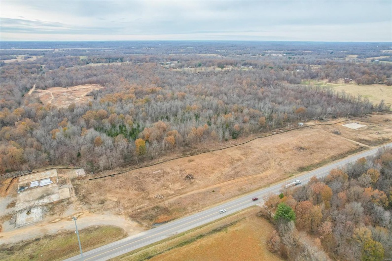 Birds eye view of property with a rural view