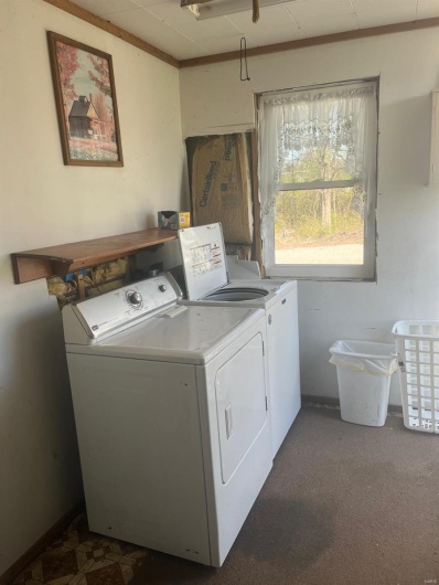 Clothes washing area with separate washer and dryer and laundry area