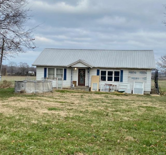 Single story home featuring a front yard
