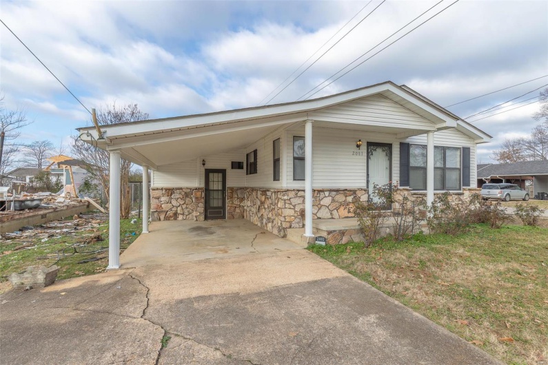 View of front of property featuring a carport