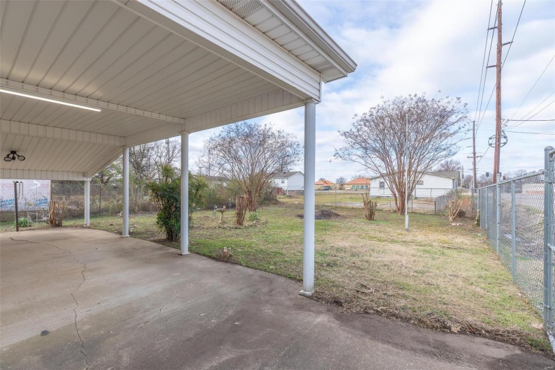 View of patio / terrace featuring a carport