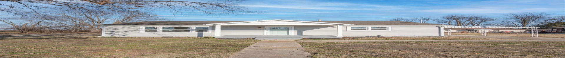 Residential For Sale View of front of home featuring a porch, a front yard, and a carport