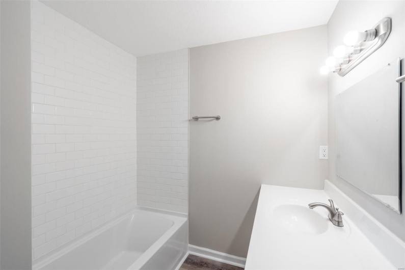 Bathroom featuring vanity and hardwood / wood-style flooring