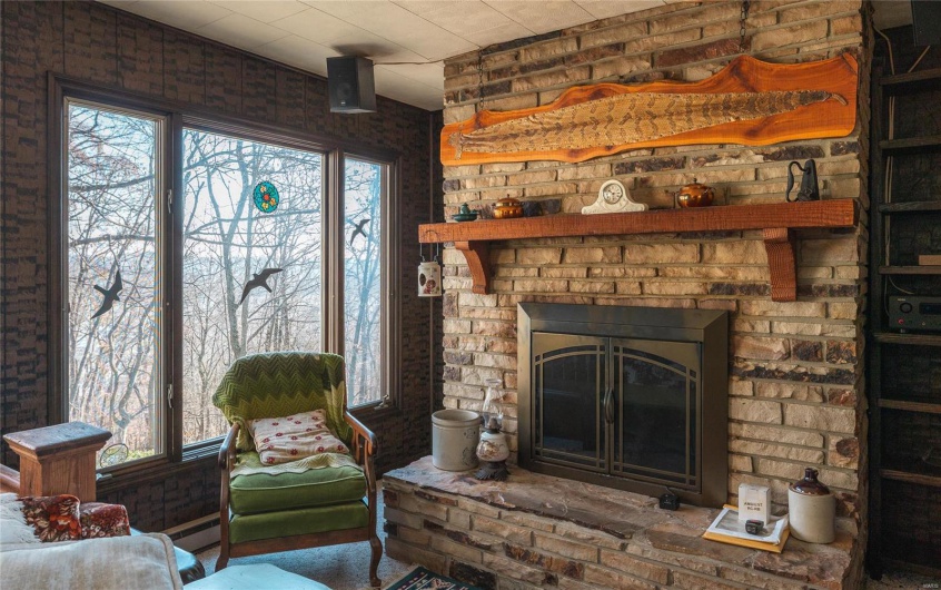 Living room with a brick fireplace