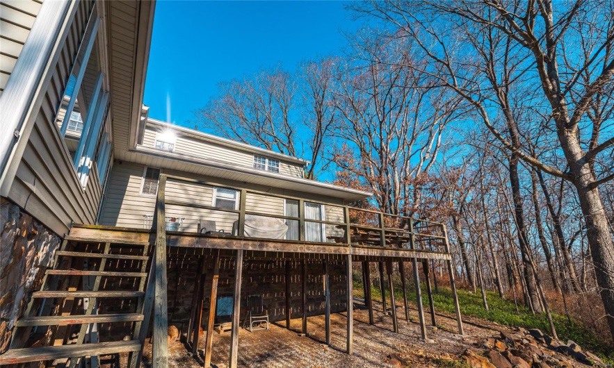 Rear view of house with a deck